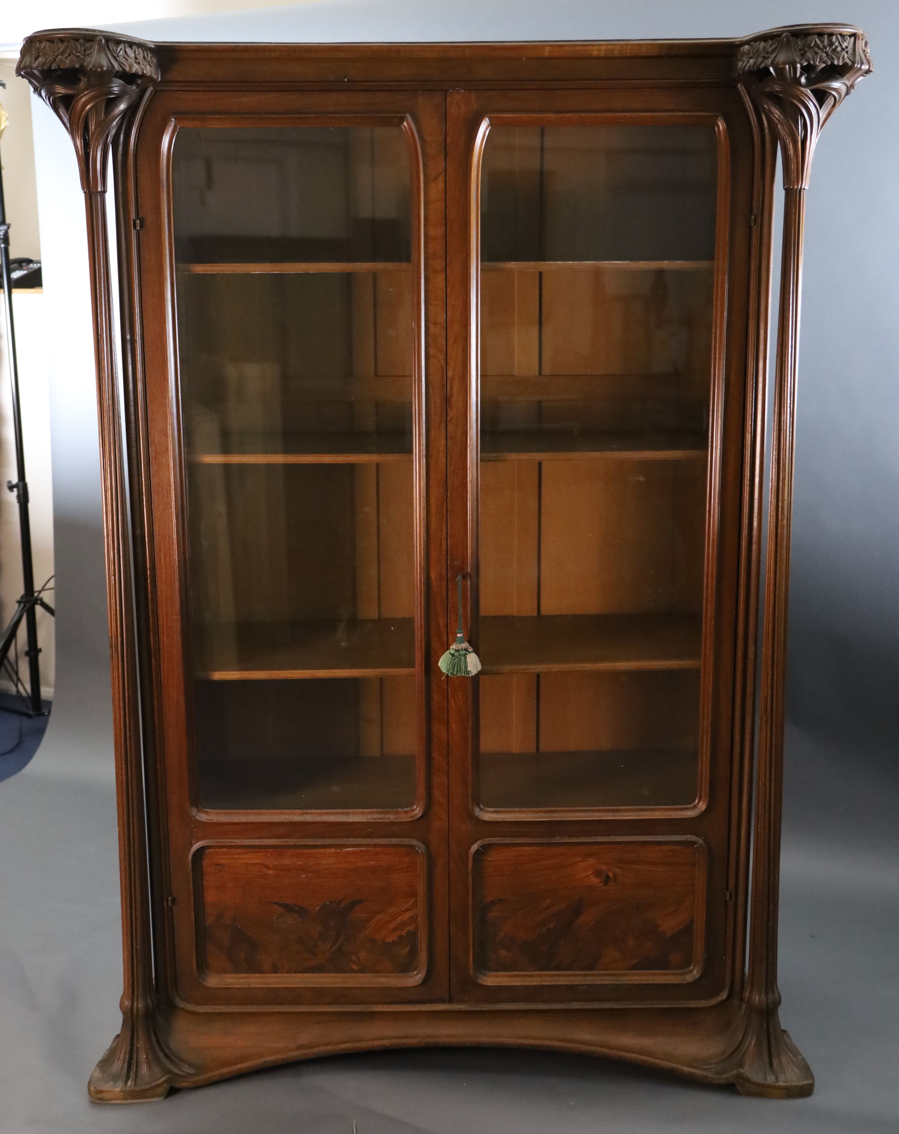 An Art Nouveau walnut and marquetry vitrine by Majorelle, W.5ft D.1ft 10in. H.6ft 7in.